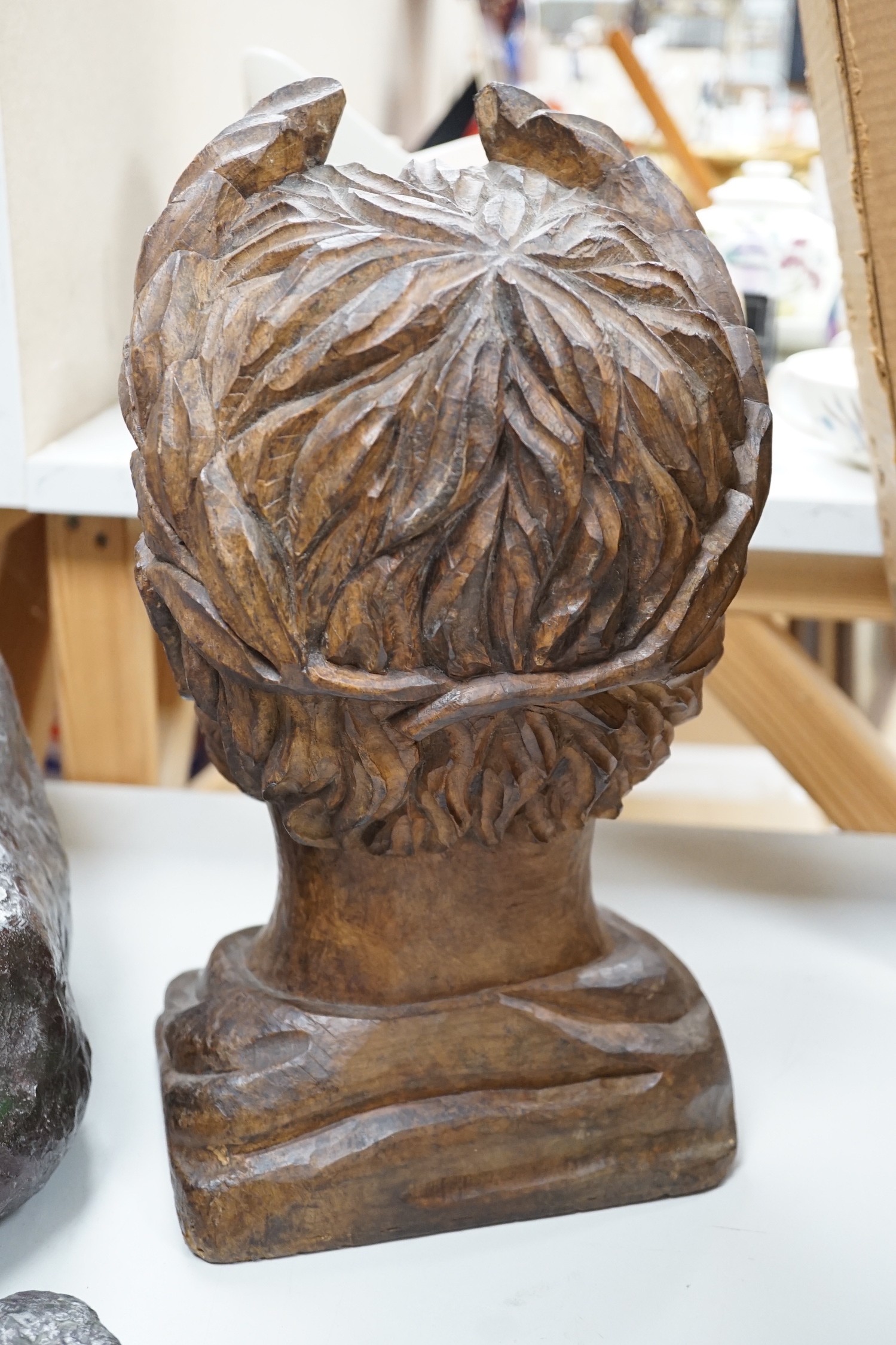 A carved walnut bust of a Roman emperor, 36cm